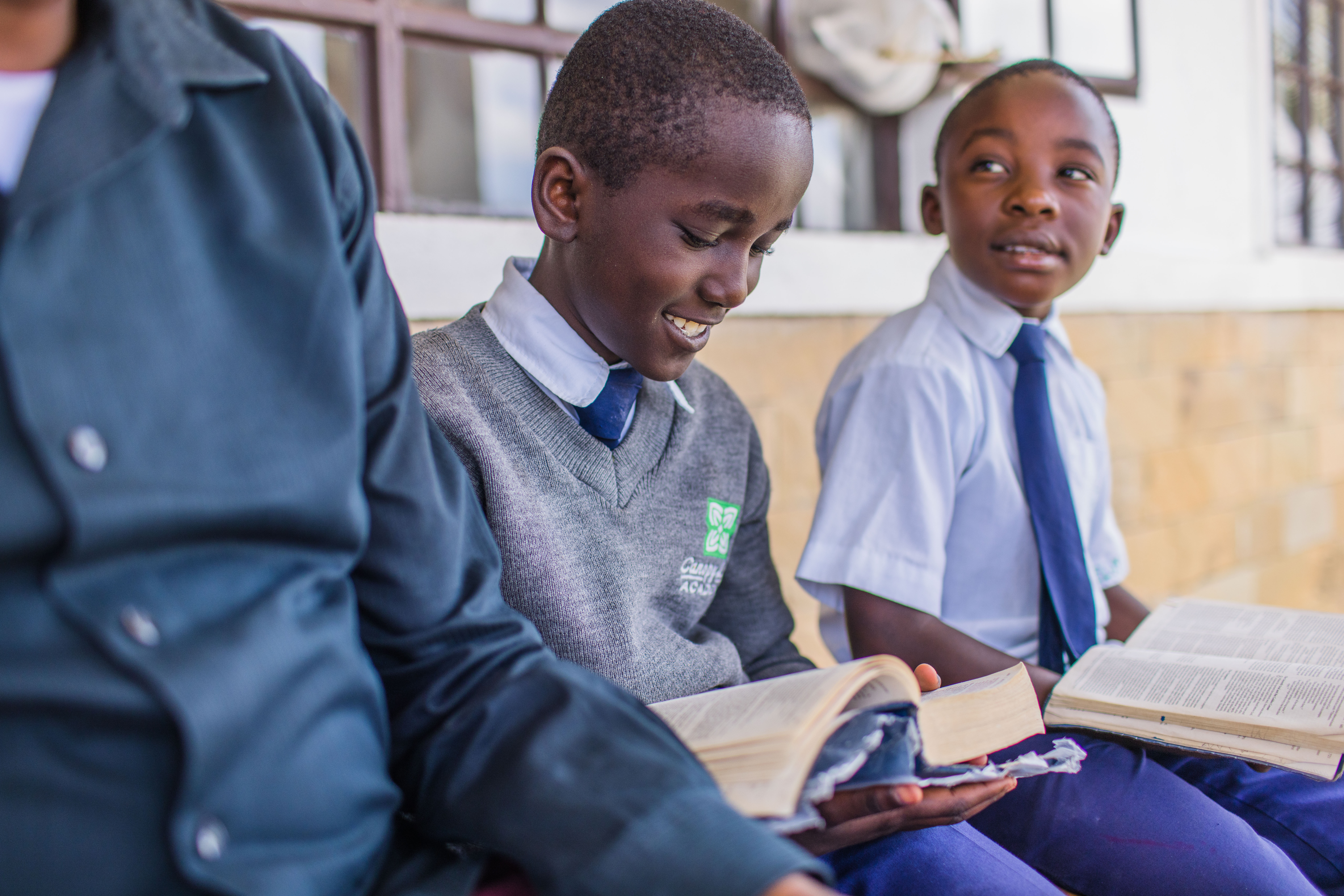 Campus updates on the spiritual program, kids in Kenya studying the Bible
