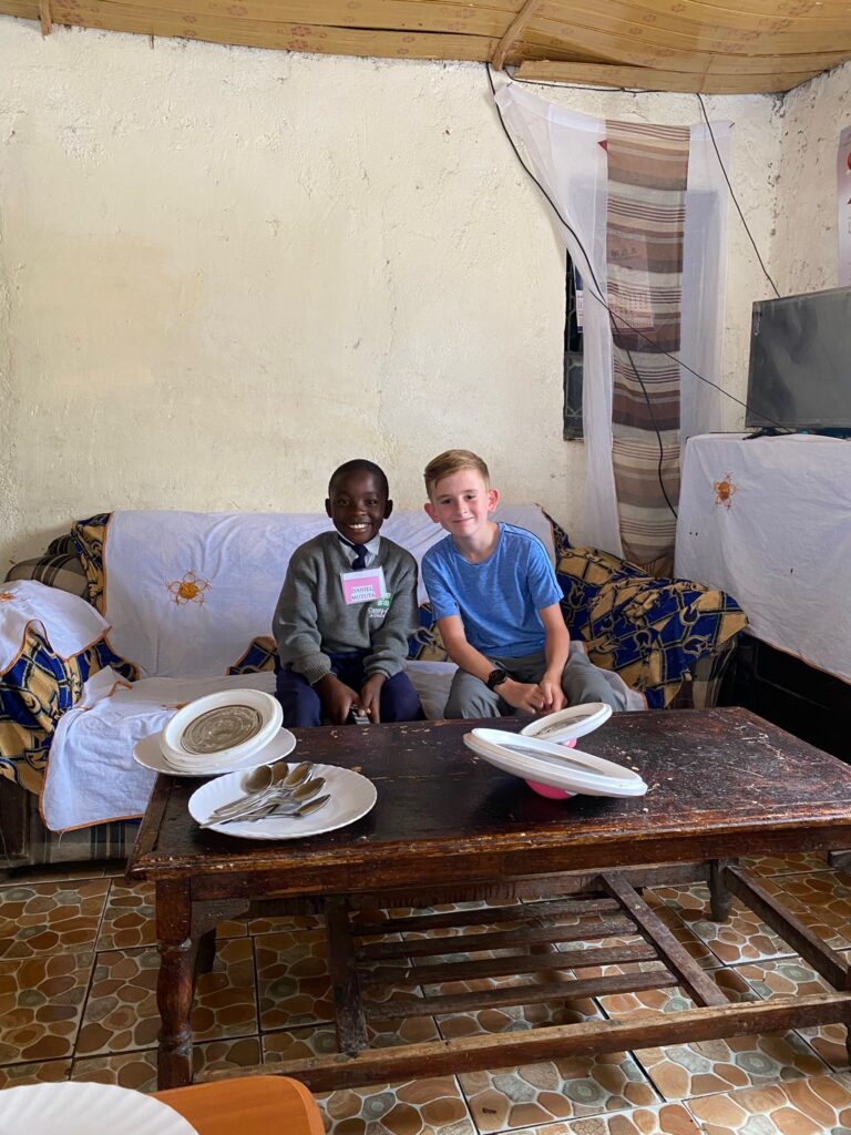 Carter and Dan  in Dan's home in Kenya